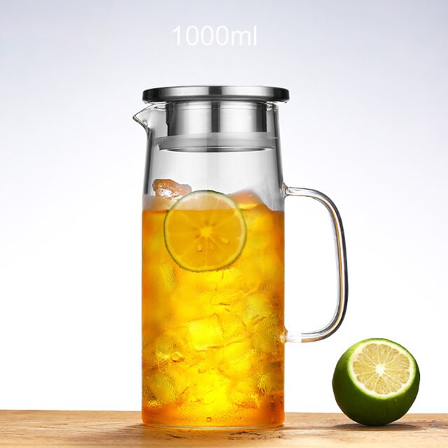 Glass cold brew pitcher with iced tea on table, clean Scandinavian lines