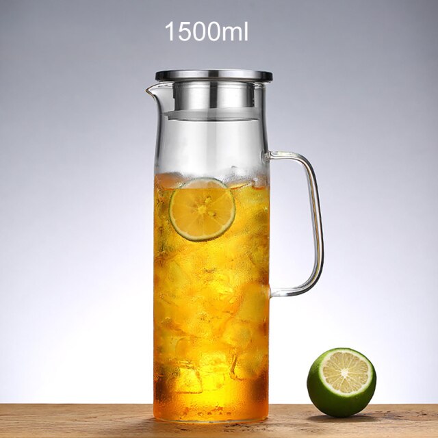 Pouring cold-brewed iced tea from glass pitcher with fitted lid