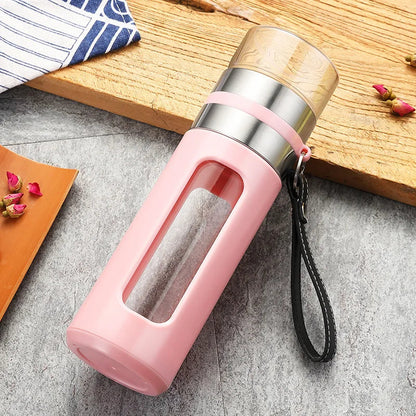 Borosilicate glass tea infuser bottle filled with freshly brewed hot loose-leaf tea