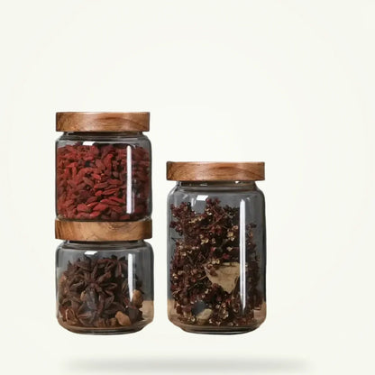 Glass tea storage jar with bamboo lid, airtight canister, packshot on plain background