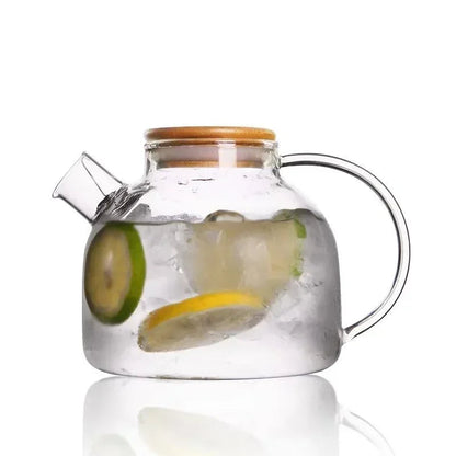Large glass teapot showing loose tea leaves steeping, clear 360-degree view