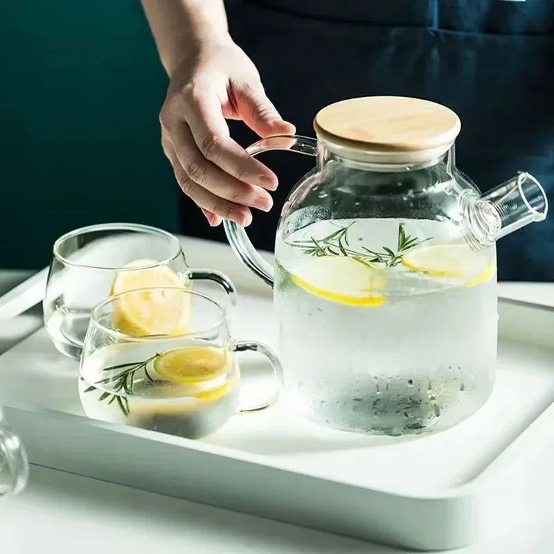 Transparent borosilicate glass teapot with loose leaf green tea steeping
