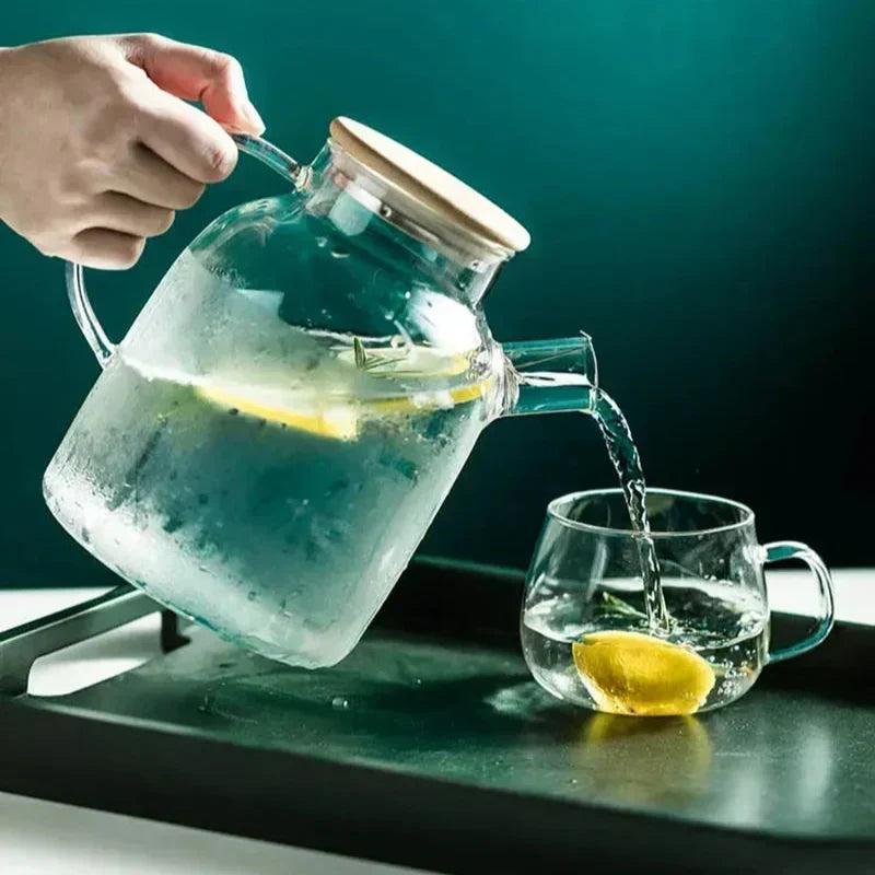 Blooming tea flower fully open inside large borosilicate glass teapot