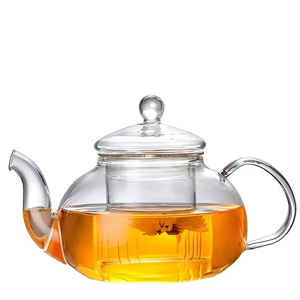 Glass teapot with infuser on cozy kitchen counter morning setup