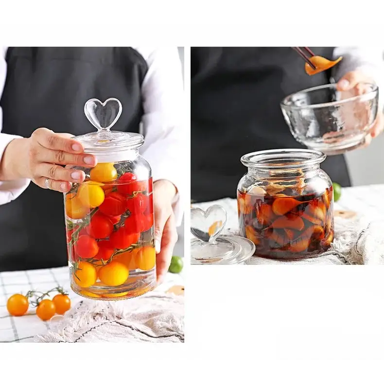 Glass teapot with heart lid displayed on a kitchen shelf among tea accessories