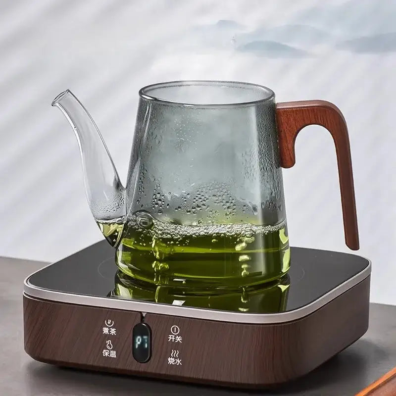 Glass teapot with walnut handle and long spout