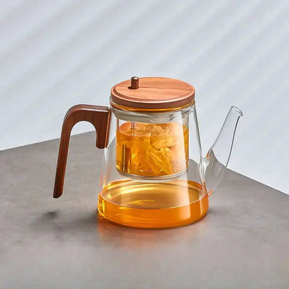 Clear glass teapot with tea steeping