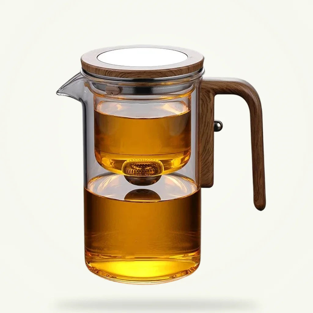 Glass teapot with infuser and one-click leaf separation, full product view on neutral background