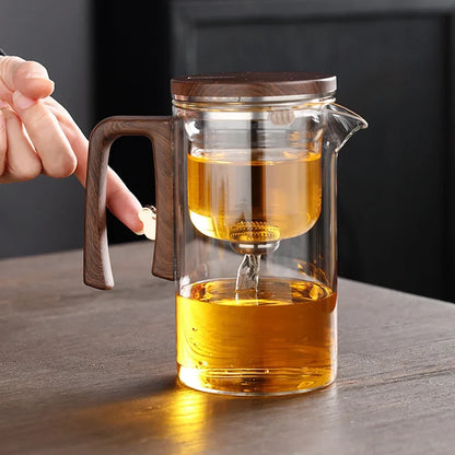 Glass teapot with magnetic infuser, wood handle detail and clear glass body