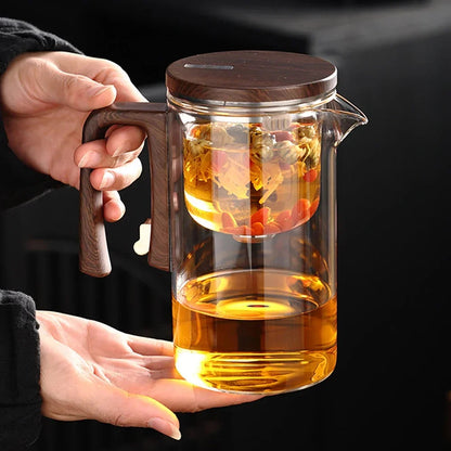 Borosilicate glass teapot with wood handle, side profile showing infuser inside