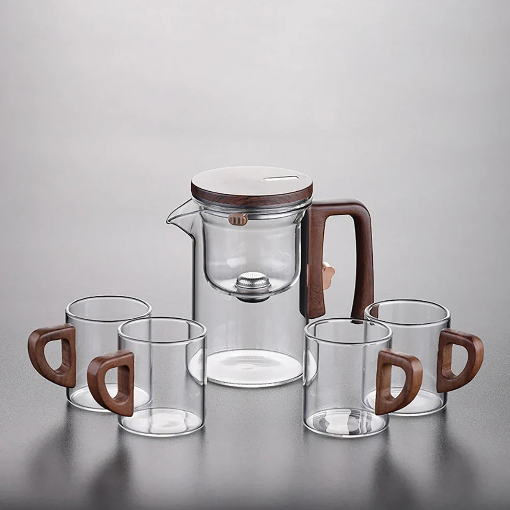 Close-up of natural wood handle on borosilicate glass teapot, cool-touch grip