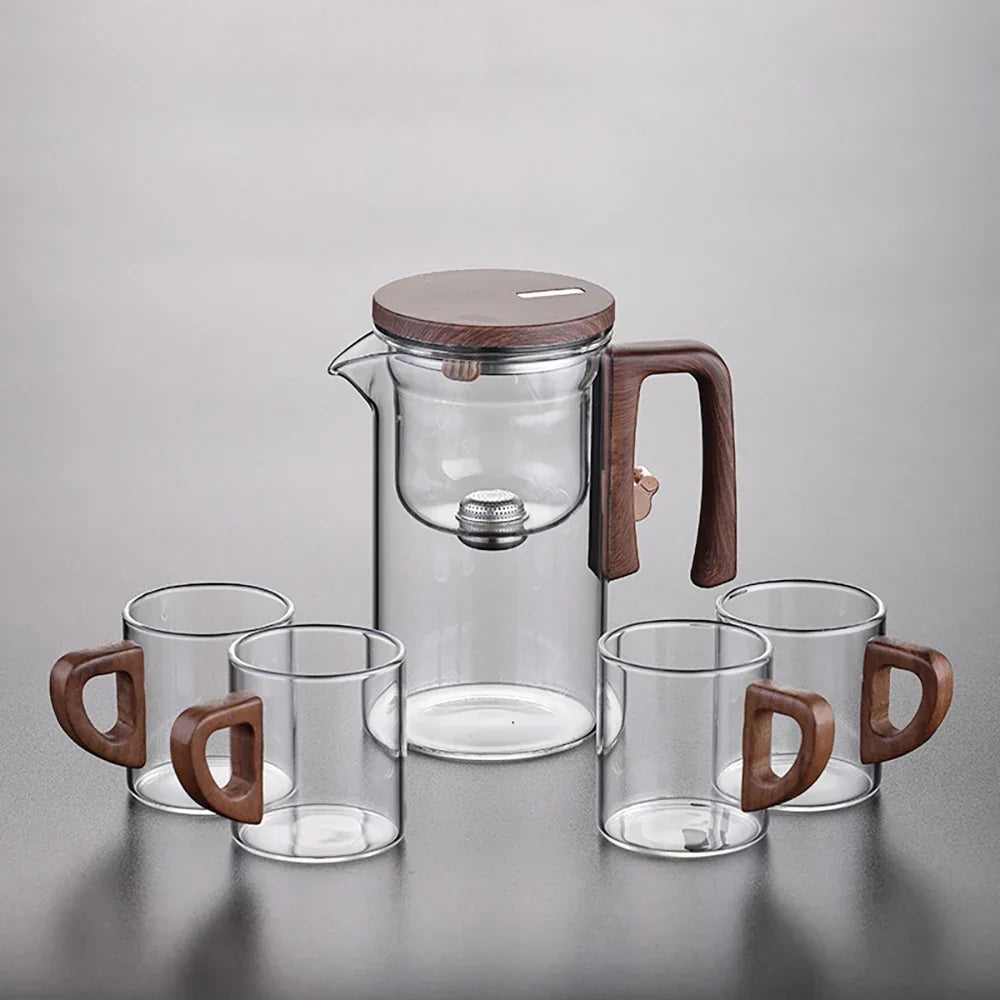 Clean empty glass teapot with removable magnetic infuser beside it, ready to use