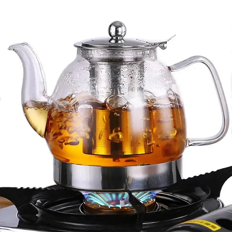 Glass teapot with stainless steel lid and removable infuser basket, detail view