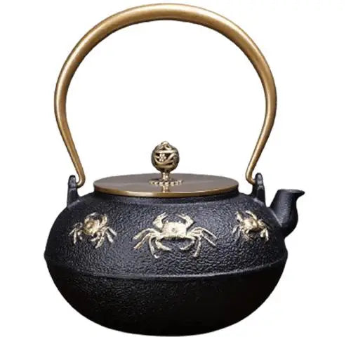 Golden crab cast iron teapot with black and gold enamel finish
