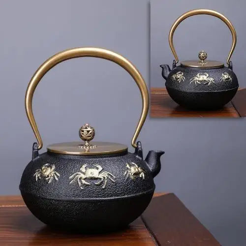 Large cast iron teapot with golden crab motif and generous capacity