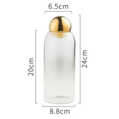 Large golden glass tea canister with lid, front view showing full size