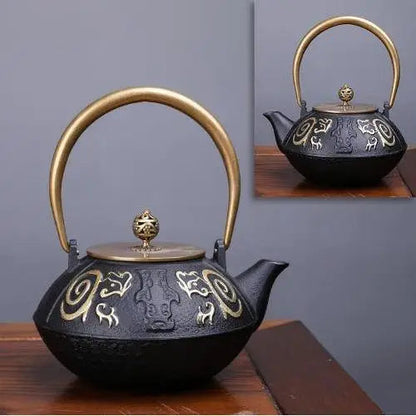 Cast iron teapot with infinite spiral design and gold accents
