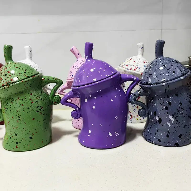 Colorful tea bag storage box on kitchen counter next to kettle