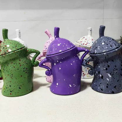 Colorful tea bag storage box on kitchen counter next to kettle