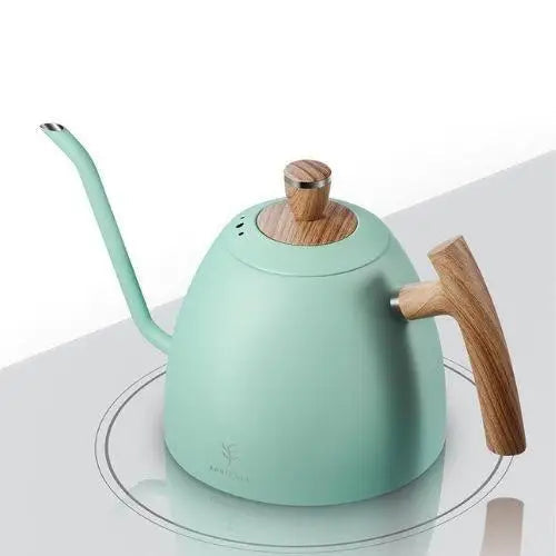 Olive-green gooseneck kettle sitting on an induction cooktop