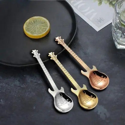 Three guitar tea spoons in different colors