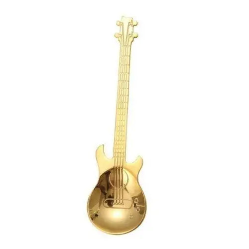 Gold guitar shaped tea spoon close up