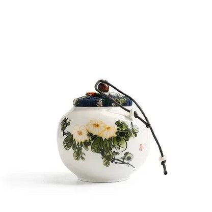 Small hand-painted tea canister fabric lid and cord closure detail