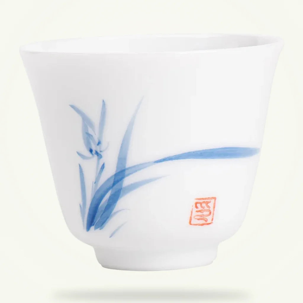 Hand-Painted White Porcelain Tea Cup, product photo on a plain background