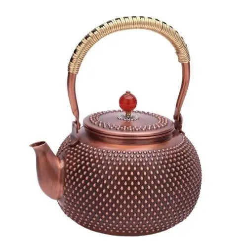 Handcrafted copper teapot with red enamel