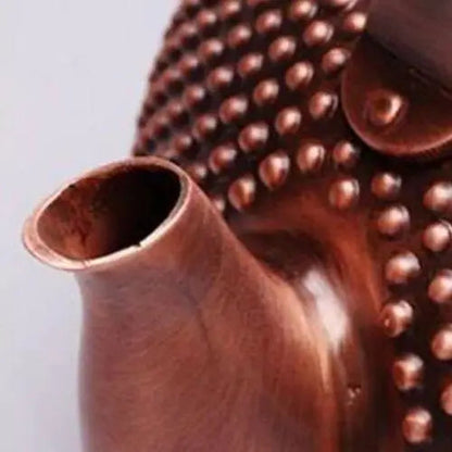 Copper teapot spout close up