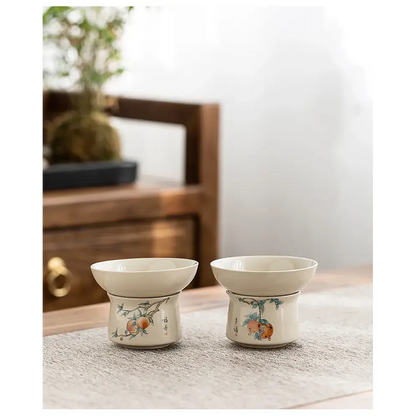 Handmade ceramic tea strainer with wooden table