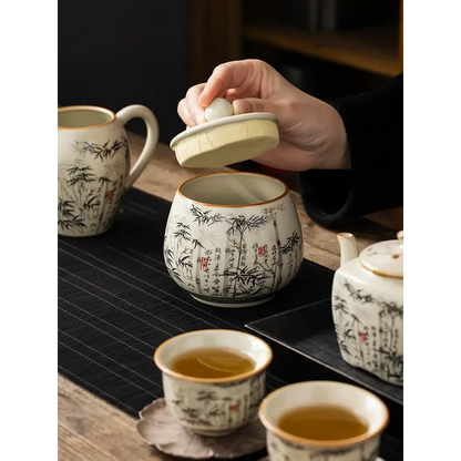 Ceramic tea storage jar with hand-painted bamboo motif and natural bamboo lid