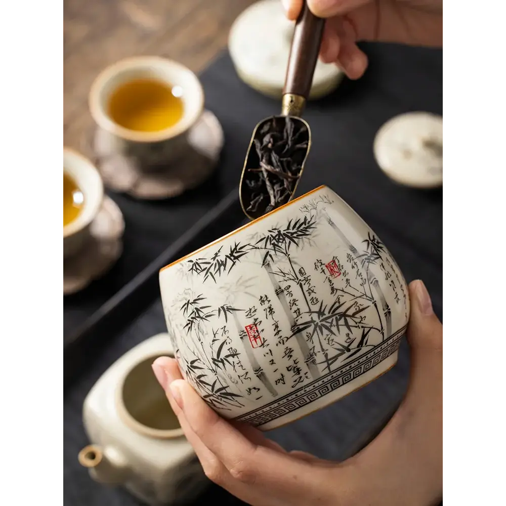 Ceramic tea canister with press-fit bamboo lid for loose leaf tea storage