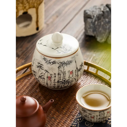 Close-up of hand-painted bamboo forest glaze detail on ceramic tea canister