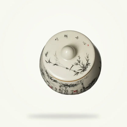 Handmade ceramic tea canister with bamboo forest design, 300ml, front view on plain background