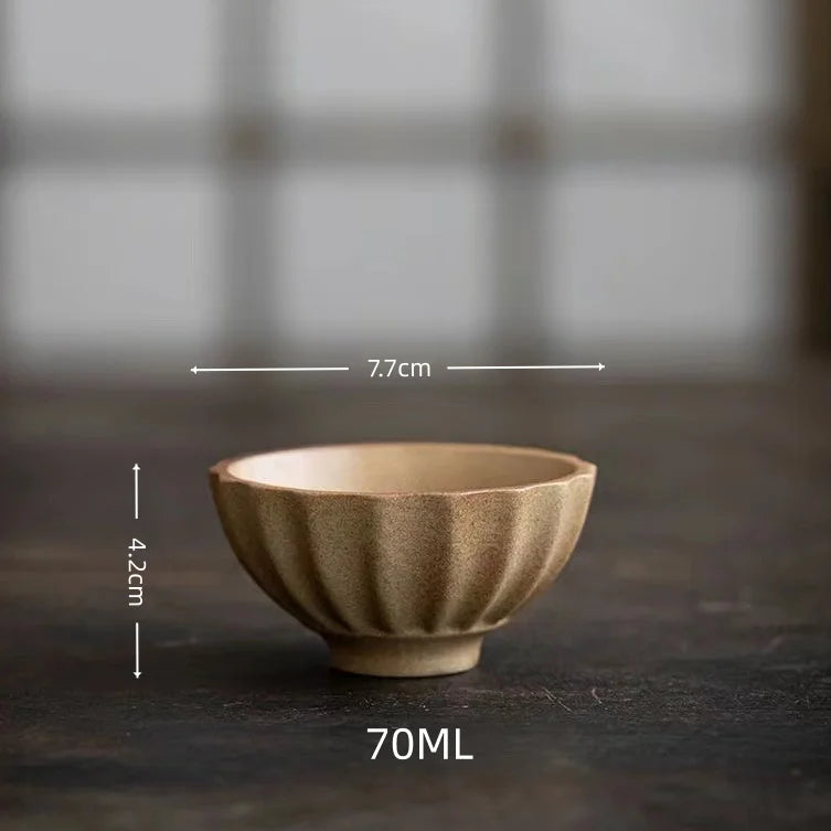 Japanese wabi-sabi stoneware cup top view with glaze pooling detail