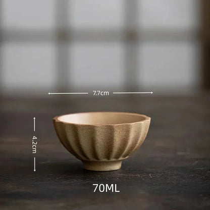 Japanese wabi-sabi stoneware cup top view with glaze pooling detail