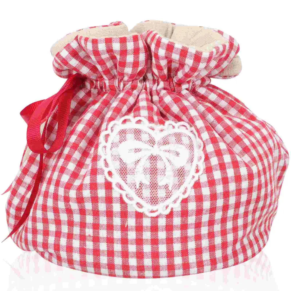 Heart pattern fabric teapot cozy fitted on a small teapot