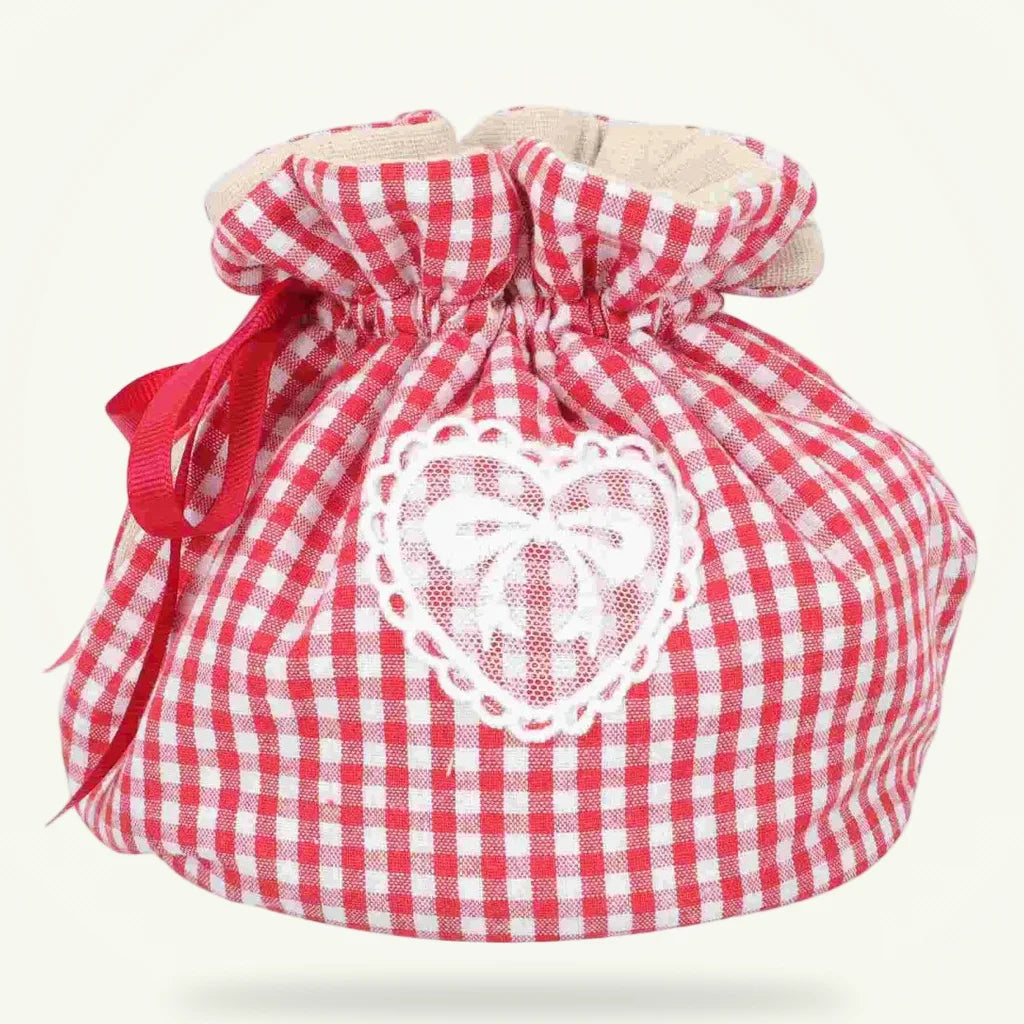 Heart pattern fabric teapot cozy 20x15 cm on plain background