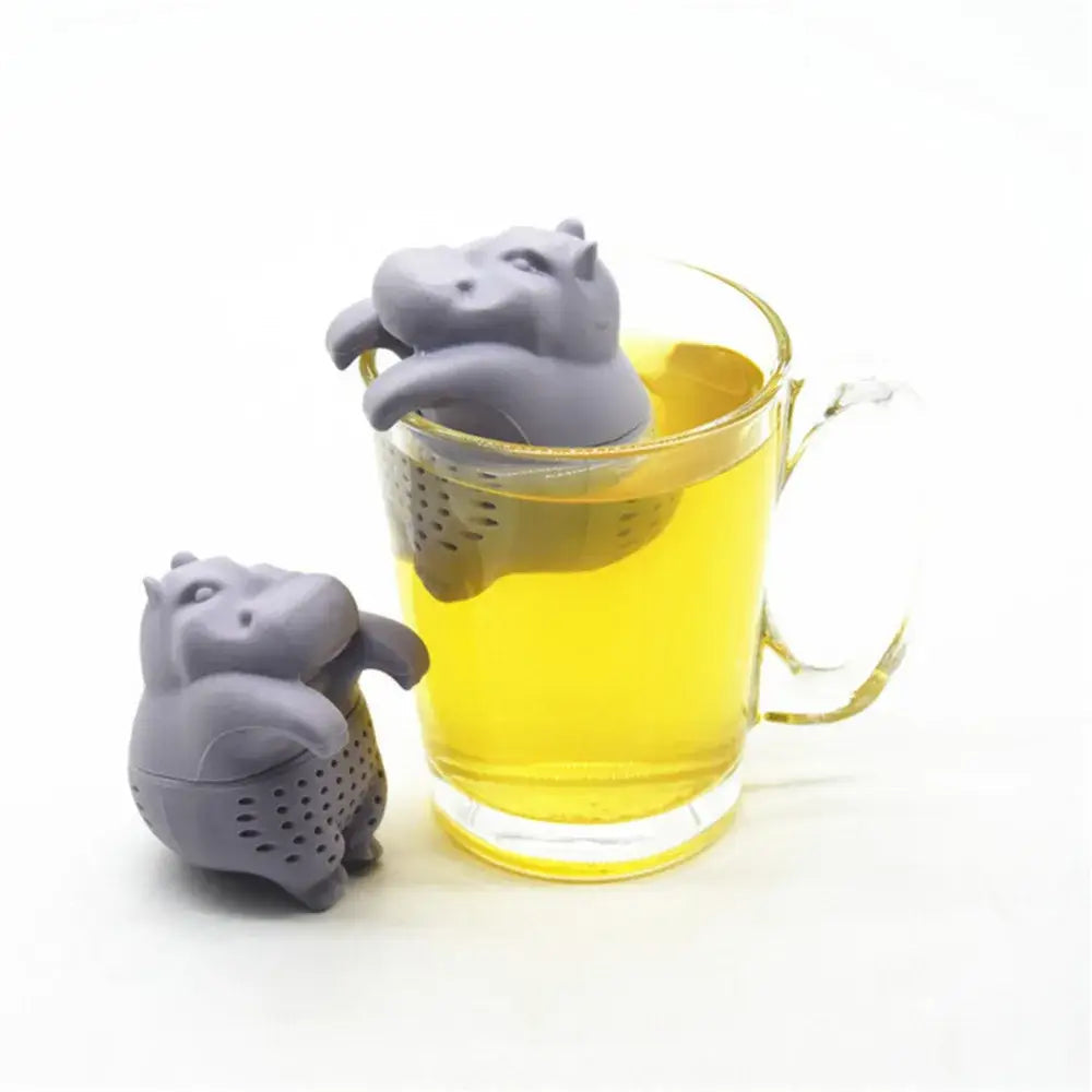 Hippo tea infuser with loose leaf tea on a saucer
