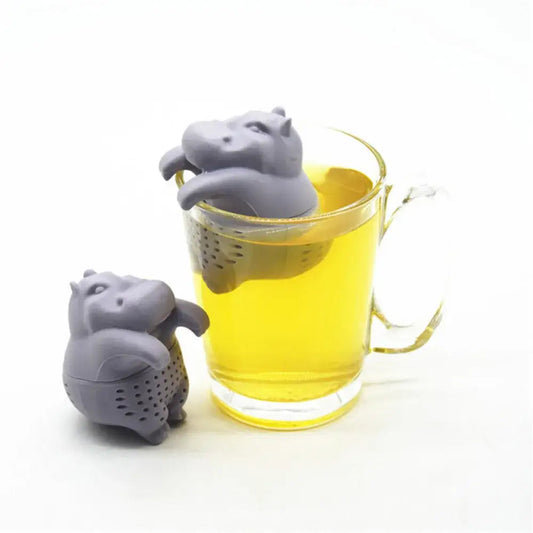 Hippo tea infuser with loose leaf tea on a saucer