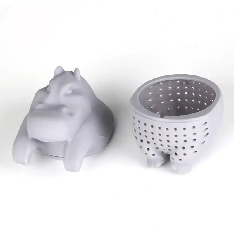 Hippo tea infuser with a cup of brewed tea