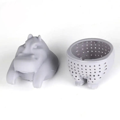 Hippo tea infuser with a cup of brewed tea