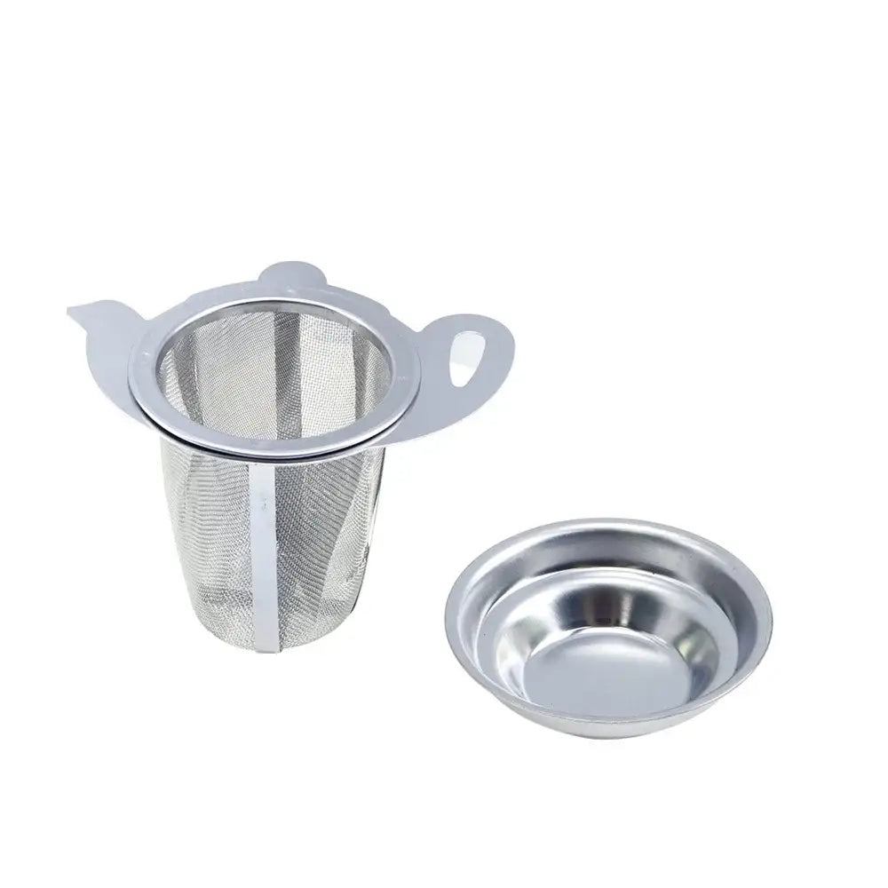 Stainless steel tea infuser sitting in a white mug