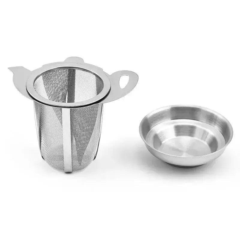 Tea infuser with drip tray on wooden table