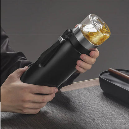 Insulated stainless steel teapot with black removable infuser, side view showing double-wall body