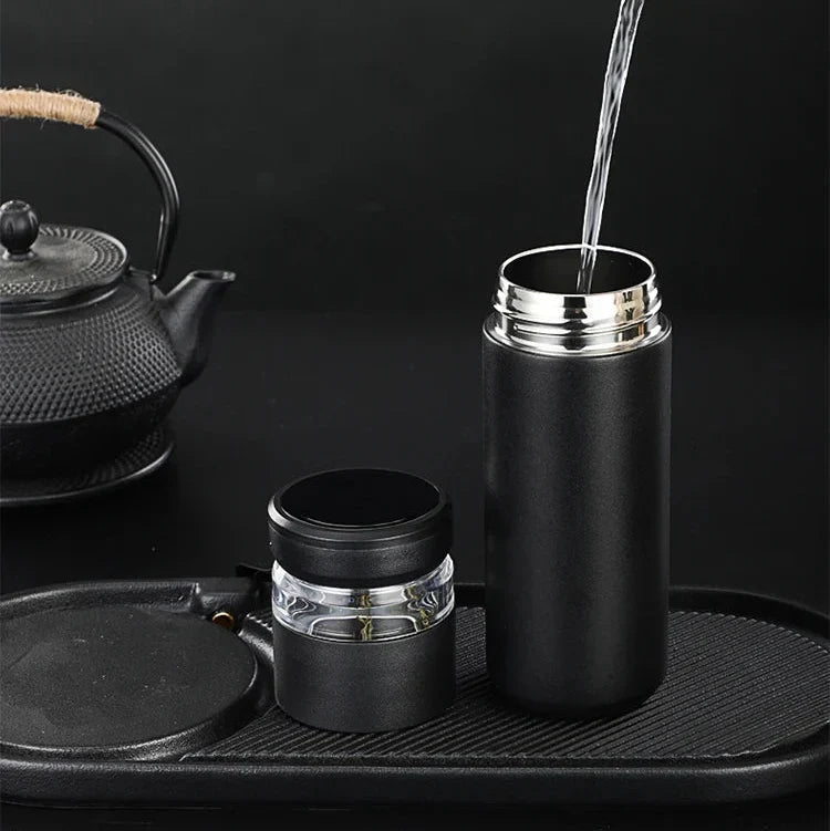 Leak-proof tea thermos with loose-leaf infuser on office desk, black variant