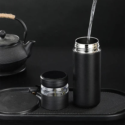 Leak-proof tea thermos with loose-leaf infuser on office desk, black variant