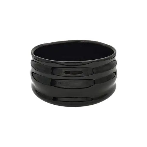 Japanese black chawan matcha bowl on wooden table