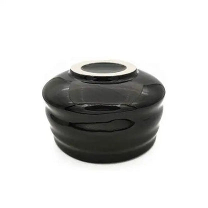 Bottom of Japanese black chawan showing ceramic texture